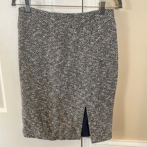 Navy and cream medium thickness tweed pencil skirt with front slit.